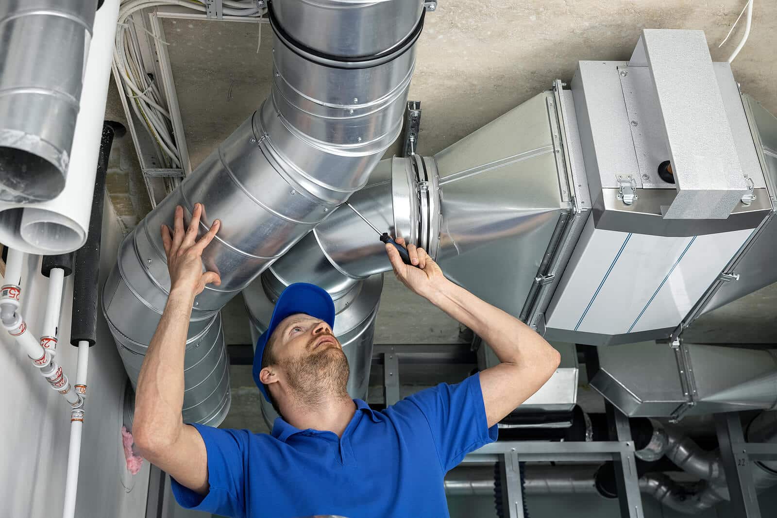 HVAC technician inspecting and repairing air ducts in Los Altos
