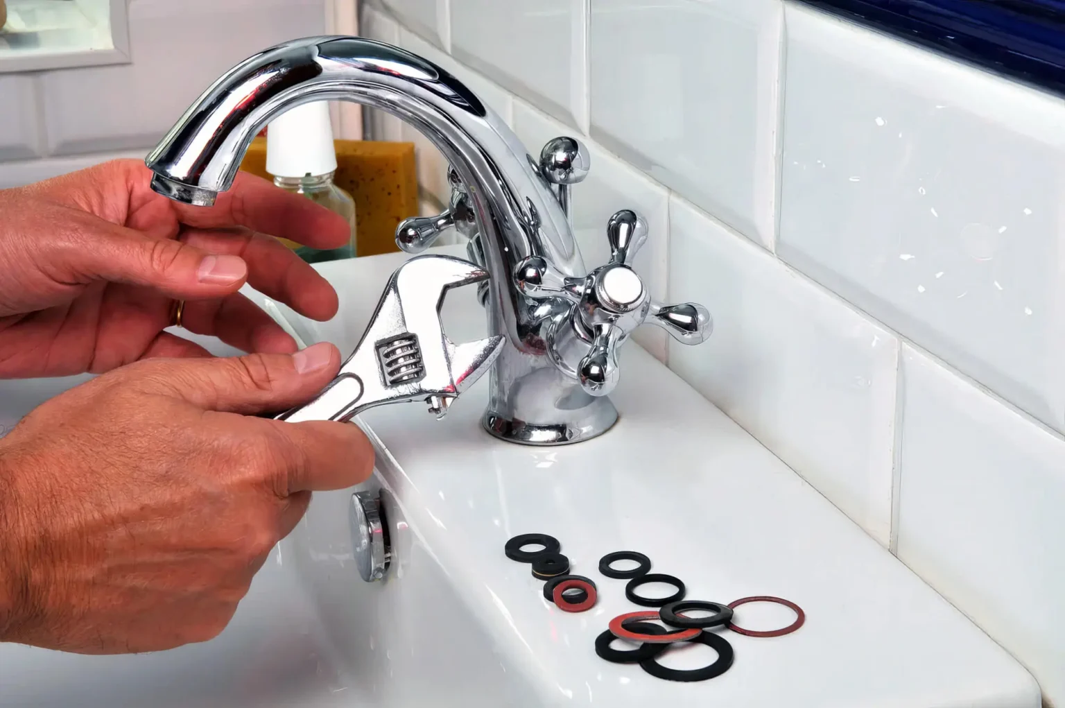 Plumber maintaining a bathroom faucet in Los Altos