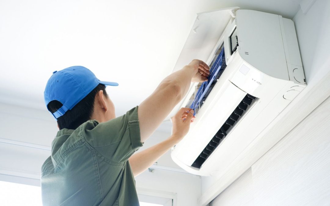 HVAC technician servicing a ductless mini split in Los Altos