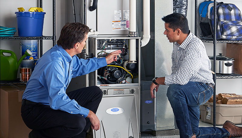 Technician evaluating a furnace for repair or replacement in Los Altos