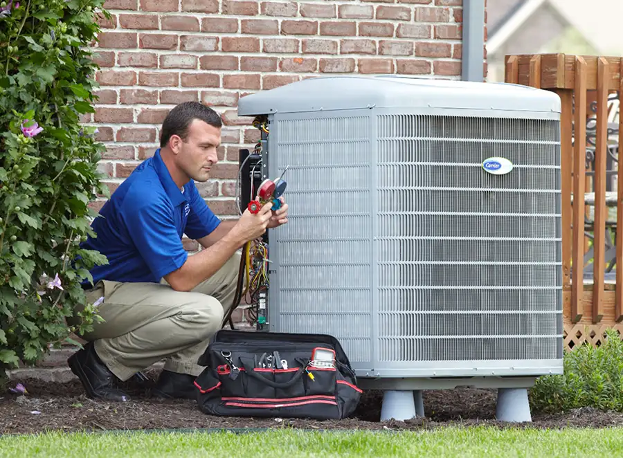 HVAC technician inspecting an outdoor AC unit in Los Altos